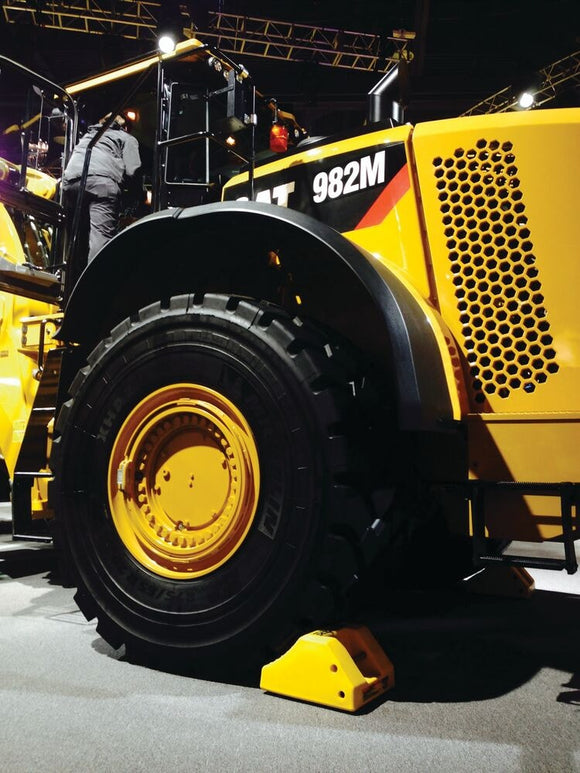Checkers Heavy-Duty Wheel Chock, 65-105 in. Tires, 275 Ton Capacity - MC3010 — application example